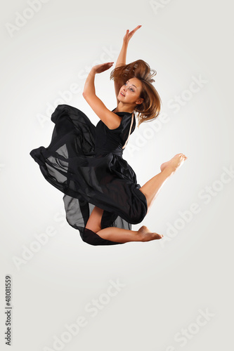 Photo: Young female dancer jumping Young female dancer jumping