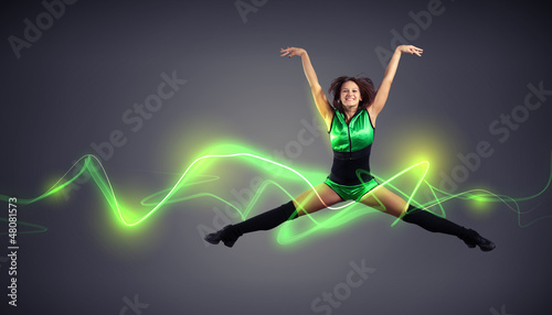 Photo: Young woman dancer. With lights effect. Young woman dancer. With lights effect.