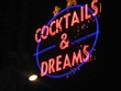 neon text  cocktails and dreams