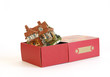 Cottage in a gift box on white background