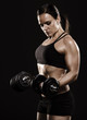 Foto: Beautiful fitness woman working out with dumbbells. Beautiful fitness woman working out with dumbbells.