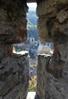 View to Bellinzona town through the ancient arrow-loop