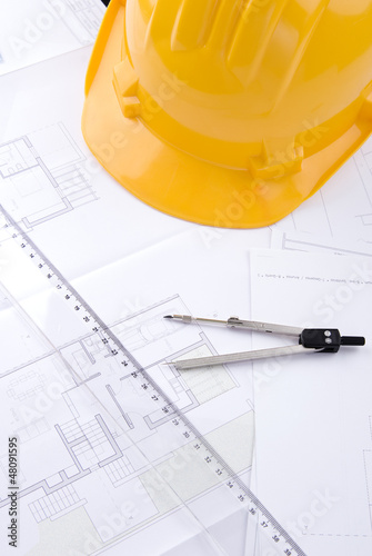 Photo: Architectural drafts on a table Architectural drafts on a table