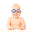 Photo: Happy smiling baby in glasses. Happy smiling baby in glasses.