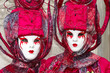 Person in Venetian costume attends Carnival of Venice.
