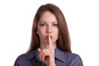 Woman calls for silence, finger on lips