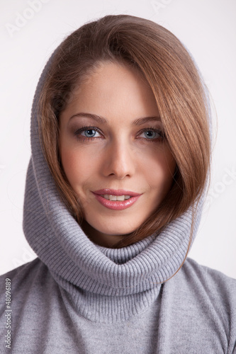 Photo: Beautiful charming girl in a wool sweater Beautiful charming girl in a wool sweater