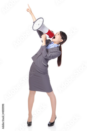 Photo: Business woman with megaphone yelling and pointing Business woman with megaphone yelling and pointing