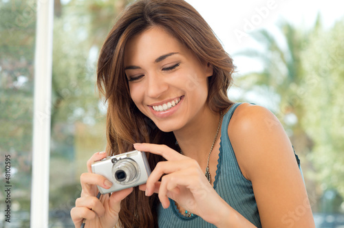 Photo: Happy Woman Taking Pictures Happy Woman Taking Pictures