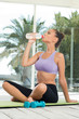 Sporty Woman Drinking Water