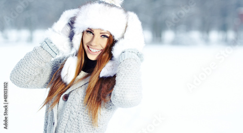 Photo: Attractive young woman in wintertime outdoor Attractive young woman in wintertime outdoor