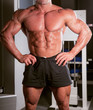 bodybuilder posing in the gym