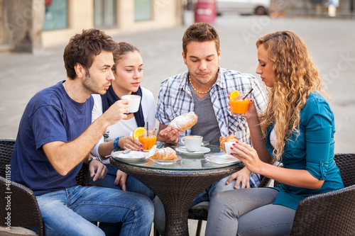 Photo: Group of Friends Having a Traditional Italian Breakfast Group of Friends Having a Traditional Italian Breakfast