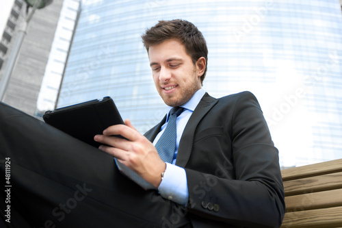 Photo: Businessman using a tablet Businessman using a tablet