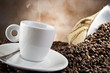 Photo: Coffee smoking on the coffee beans background Coffee smoking on the coffee beans background