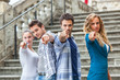 Group of Friends pointing at Camera
