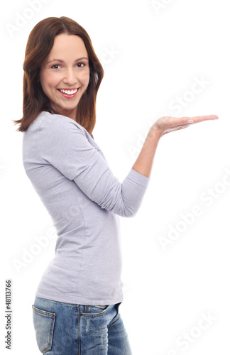Photo: Young woman presenting your product Young woman presenting your product