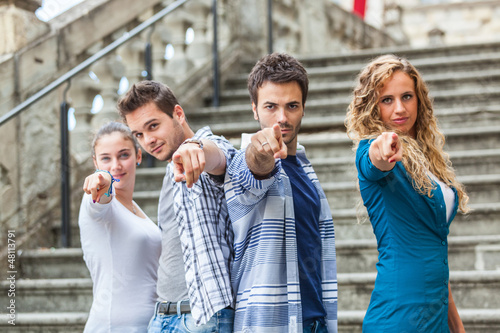 Photo: Group of Friends pointing at Camera Group of Friends pointing at Camera