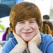outdoor portrait of relaxed cute young boy