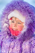Portrait of a naughty girl with frozen eyelashes closeup