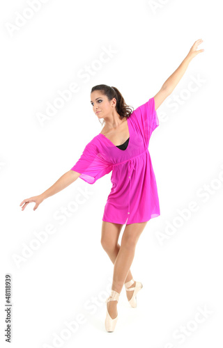Photo: beautiful young ballerina in a pink dress isolated on white beautiful young ballerina in a pink dress isolated on white