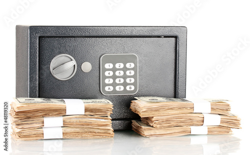 Photo: American dollars and safe isolated on white American dollars and safe isolated on white