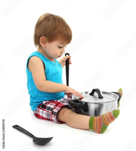 Photo: cute little boy with kitchen accessories, isolated on white cute little boy with kitchen accessories, isolated on white