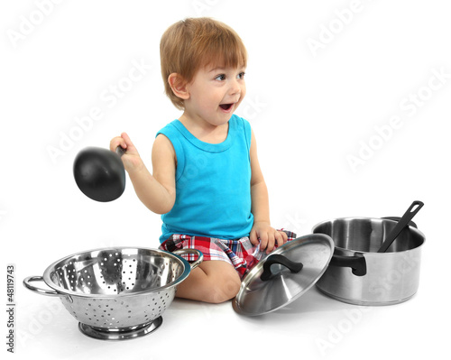 Photo: cute little boy with kitchen accessories, isolated on white cute little boy with kitchen accessories, isolated on white