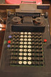 old hand calculator with the black and white keys and numbers