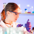 Young scientist with a smarth phone.