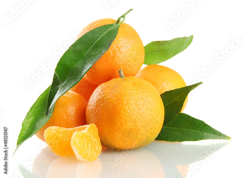 Photo: Ripe sweet tangerine with leaves, isolated on white Ripe sweet tangerine with leaves, isolated on white