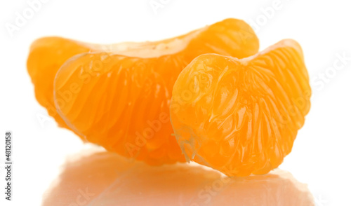 Photo: Ripe sweet tangerine cloves, isolated on white Ripe sweet tangerine cloves, isolated on white