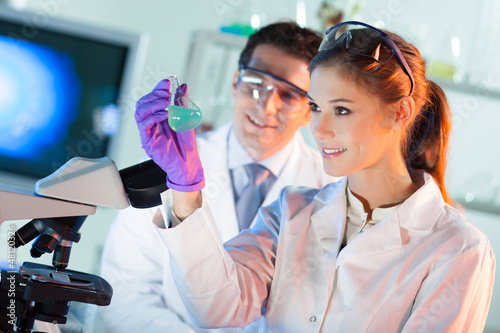 Photo: Researcher observing indikator colour shift. Researcher observing indikator colour shift.