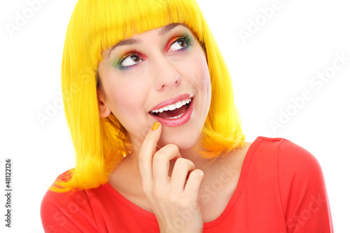 Photo: Woman with yellow wig looking up Woman with yellow wig looking up