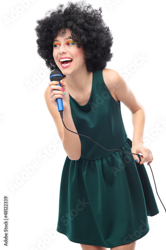 Photo: Young woman with afro hair and microphone Young woman with afro hair and microphone