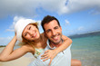 Cheerful couple enjoying vacation at the beach