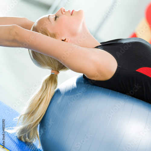 Photo: Woman with fitball at home Woman with fitball at home