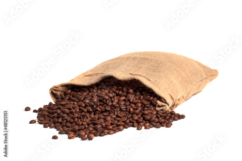 Photo: Coffee bag with roasted beans. Isolated on white. Coffee bag with roasted beans. Isolated on white.
