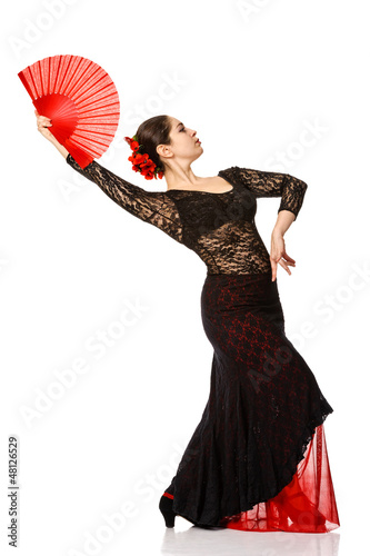 Photo: Portrait of beautiful young woman dancing flamenco Portrait of beautiful young woman dancing flamenco
