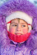 Portrait of little girl close-up on a cold day.