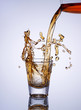 Foto: Glass of whiskey with splash Glass of whiskey with splash