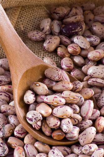 Photo: Borlotti beans in a wooden spoon and bag Borlotti beans in a wooden spoon and bag