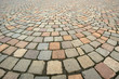 Background in the form of paving bricks (pavers) gray closeup