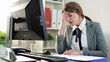 Worried businesswoman reading documents in the office
