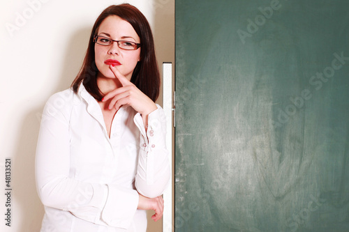 Photo: Lehrerin vor der Tafel Lehrerin vor der Tafel