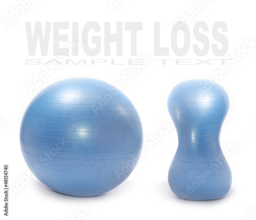 Photo: Weight loss (diet) concept. Two blue balls - fatty and slim.. Weight loss (diet) concept. Two blue balls - fatty and slim..