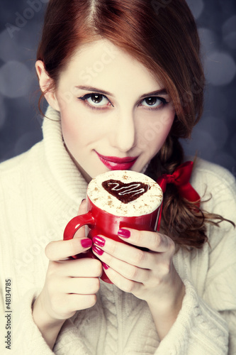 Photo: Redhead girl with coffe. St. Valentine Day Redhead girl with coffe. St. Valentine Day