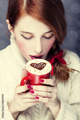 Photo: Redhead girl with coffe. St. Valentine Day Redhead girl with coffe. St. Valentine Day