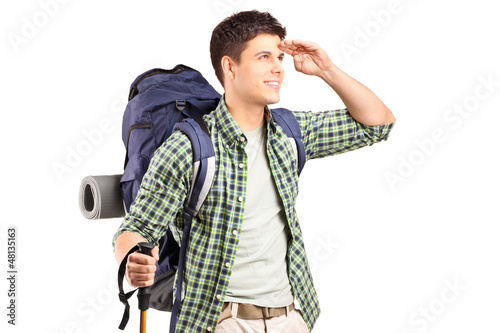 Photo: A hiker with backpack looking A hiker with backpack looking