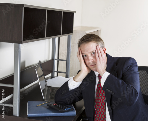 Photo: Mature man Stressed at Work Mature man Stressed at Work